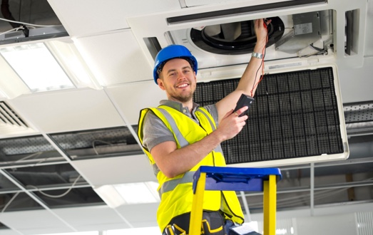 Technician Smiling — Commercial HVAC Cleaners in South East Queensland