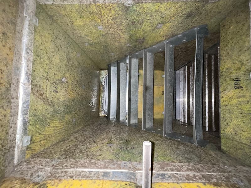 Inside a dirty air conditioner duct — Ductwork Remediation in South East QLD