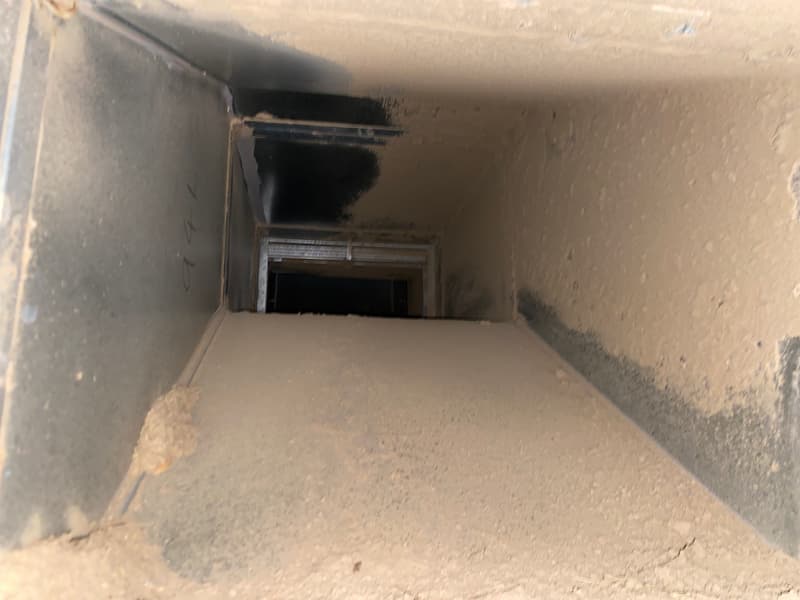 Commercial air conditioner duct covered in dirt — Ductwork Cleaning in South East QLD