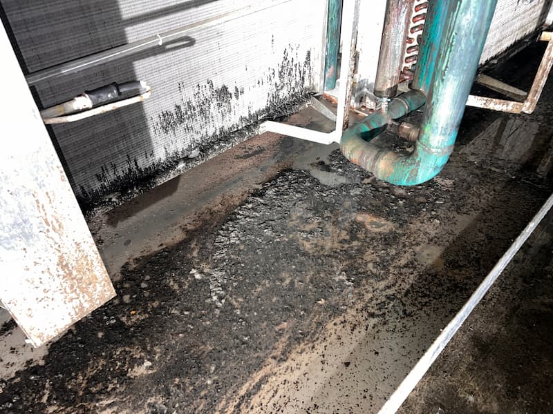 Dirty area around industrial air conditioner — Commercial Air Conditioner Cleaning in South East QLD